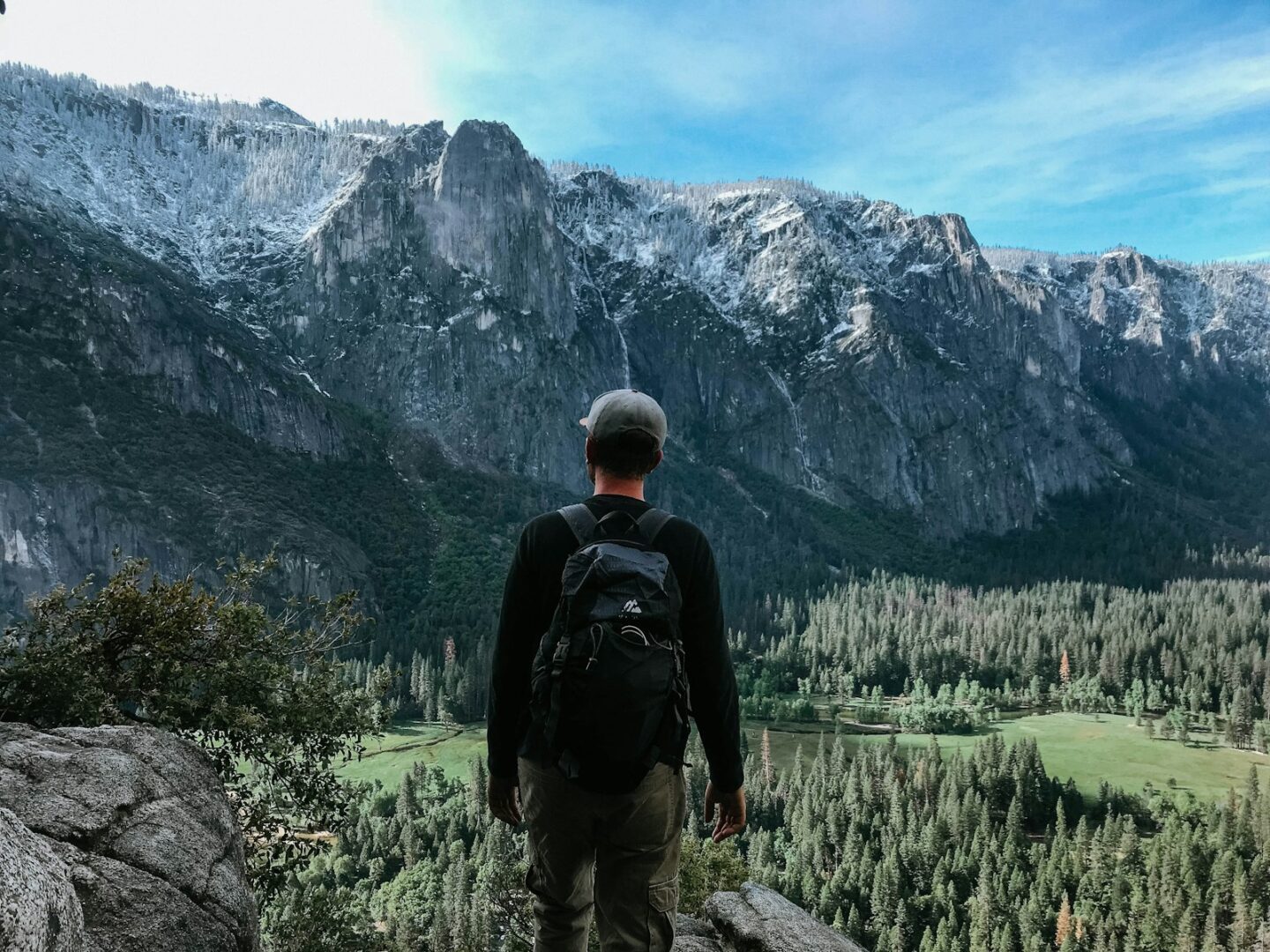 man standing on rock mountain